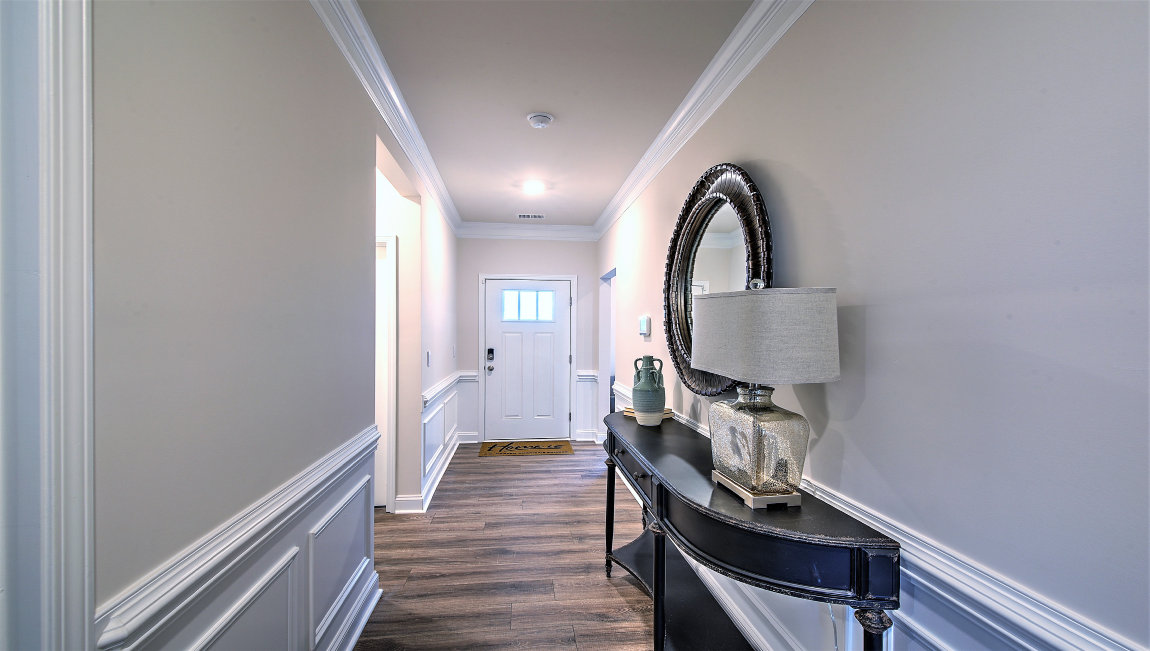 Welcoming foyer, hallway view of front door
