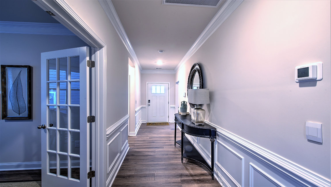 Welcoming foyer, hallway view of front door
