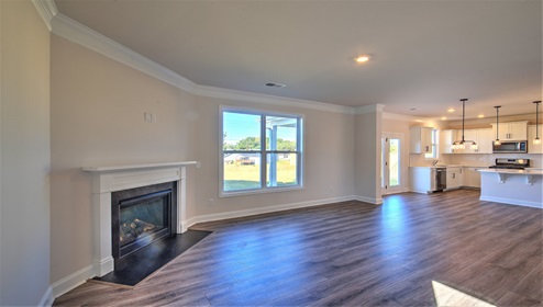Family room with fireplace and large window