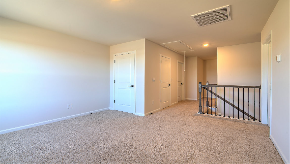 Upstairs carpeted loft area