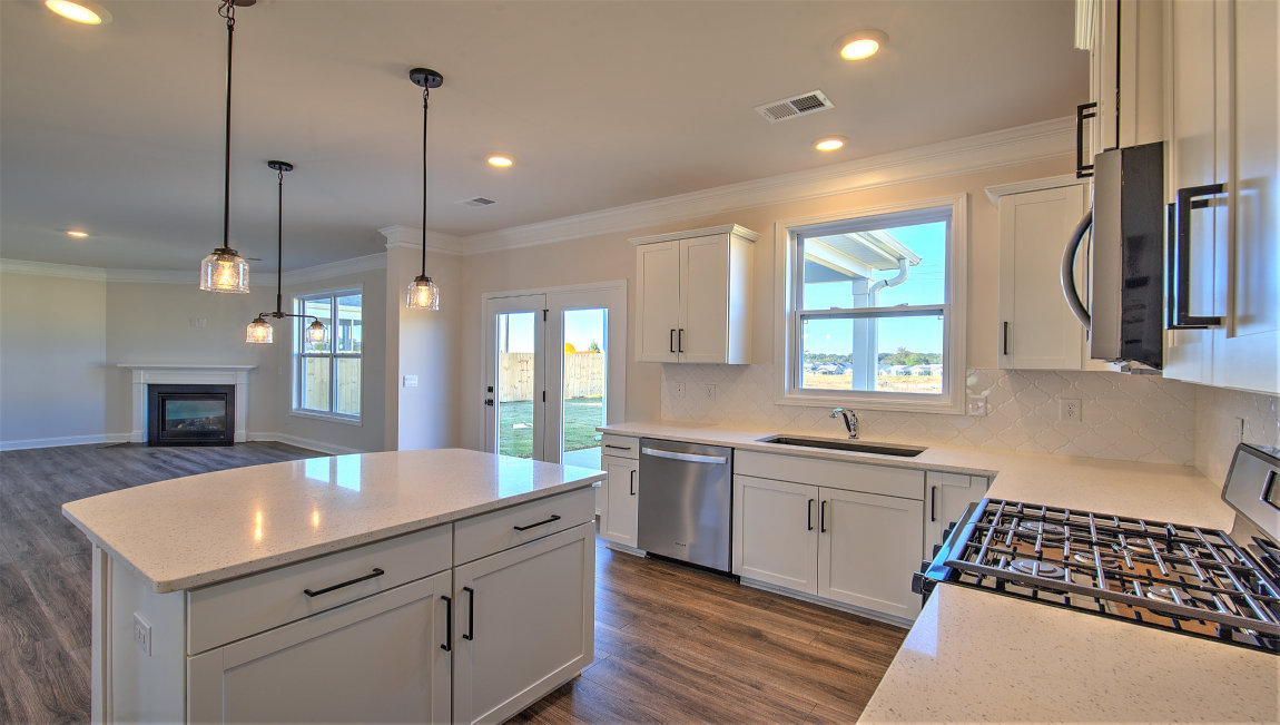 Kitchen and island, white cabinets and counters