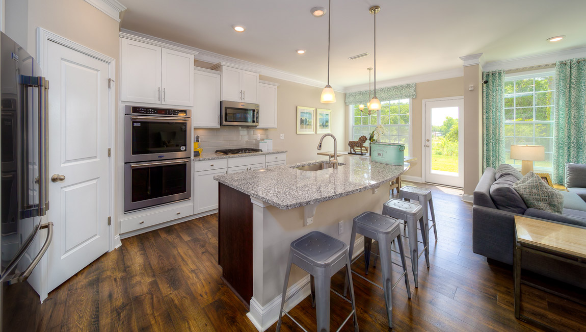 Kitchen and island with white cabinets