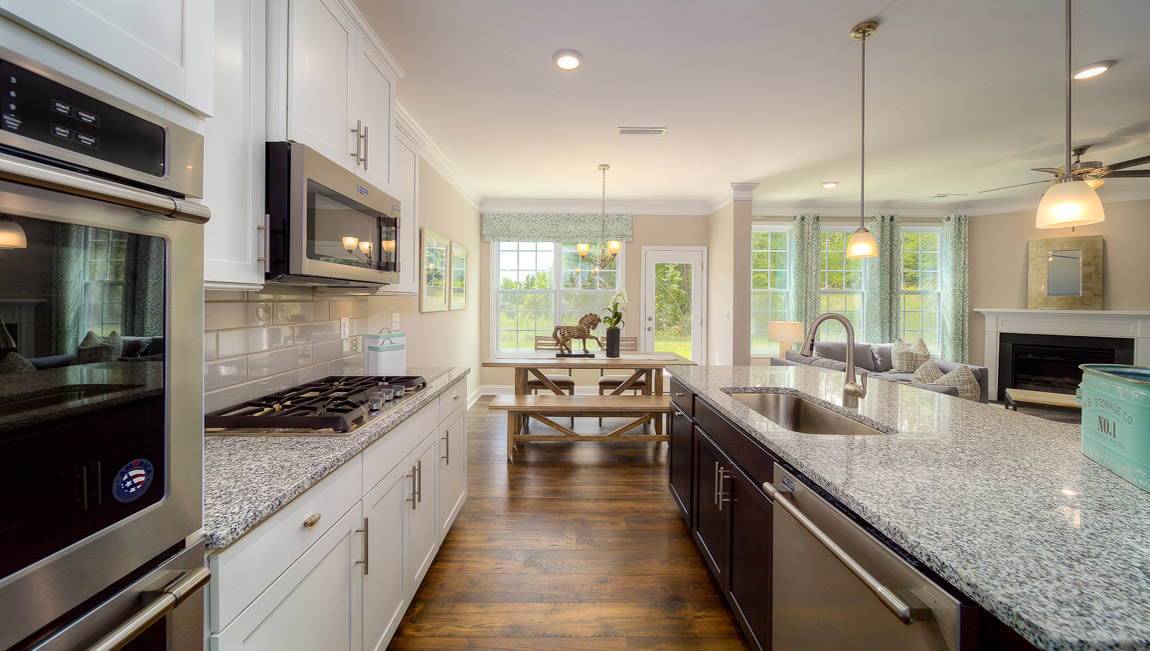 Kitchen and island with white cabinets