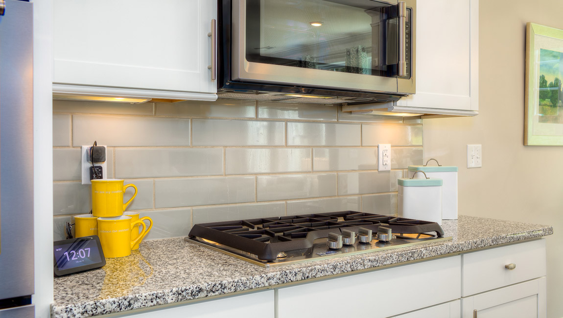 Kitchen and island with white cabinets