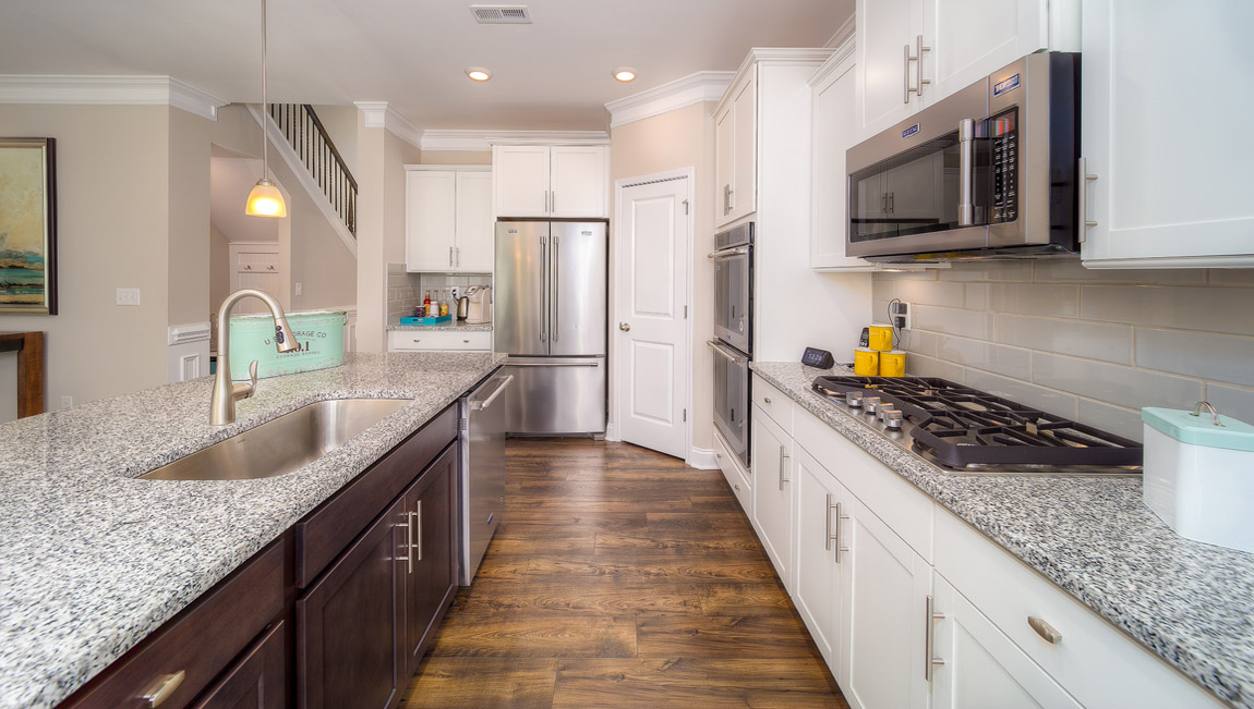 Kitchen and island with white cabinets