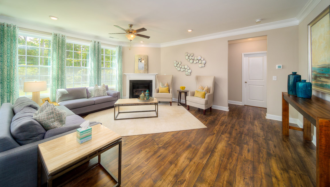 Family room with wood floors and fireplace