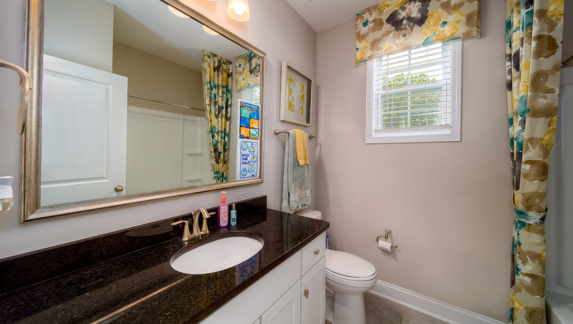 Bathroom with white cabinets