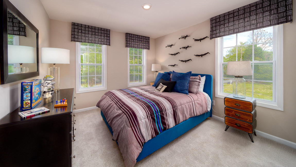 Carpeted bedroom with 3 windows