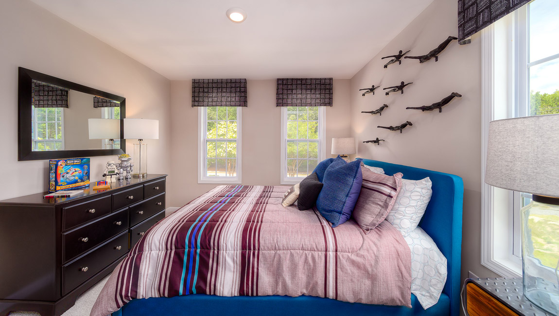 Carpeted bedroom with 3 windows