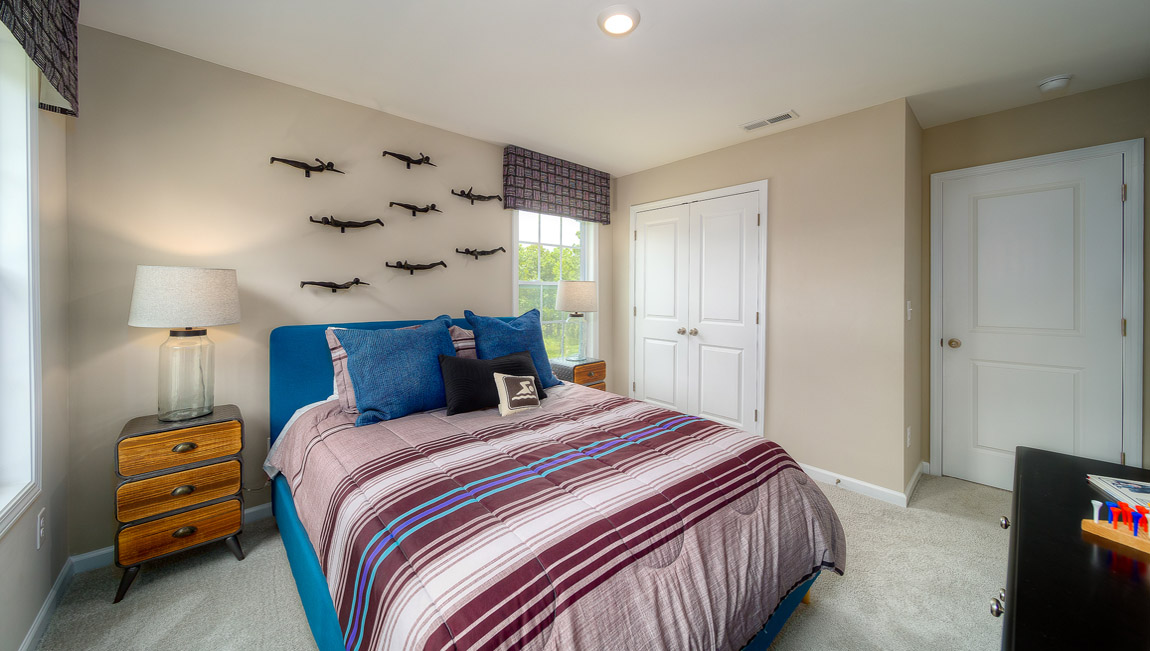 Carpeted bedroom with 3 windows