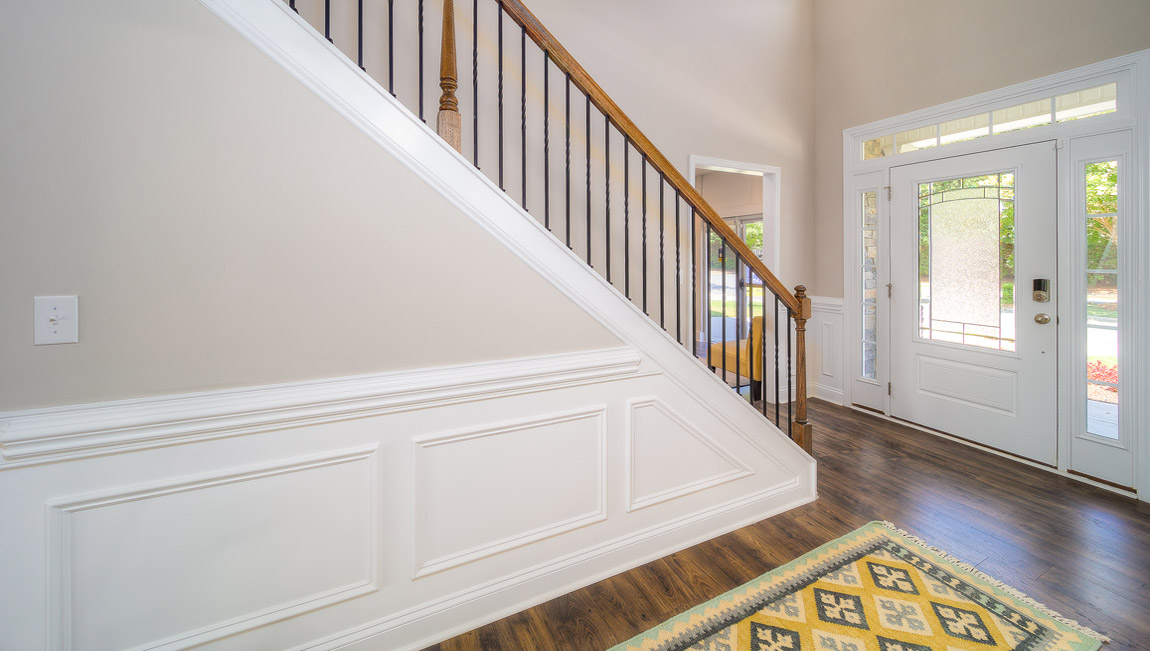 Welcoming foyer, view of stairs and front door