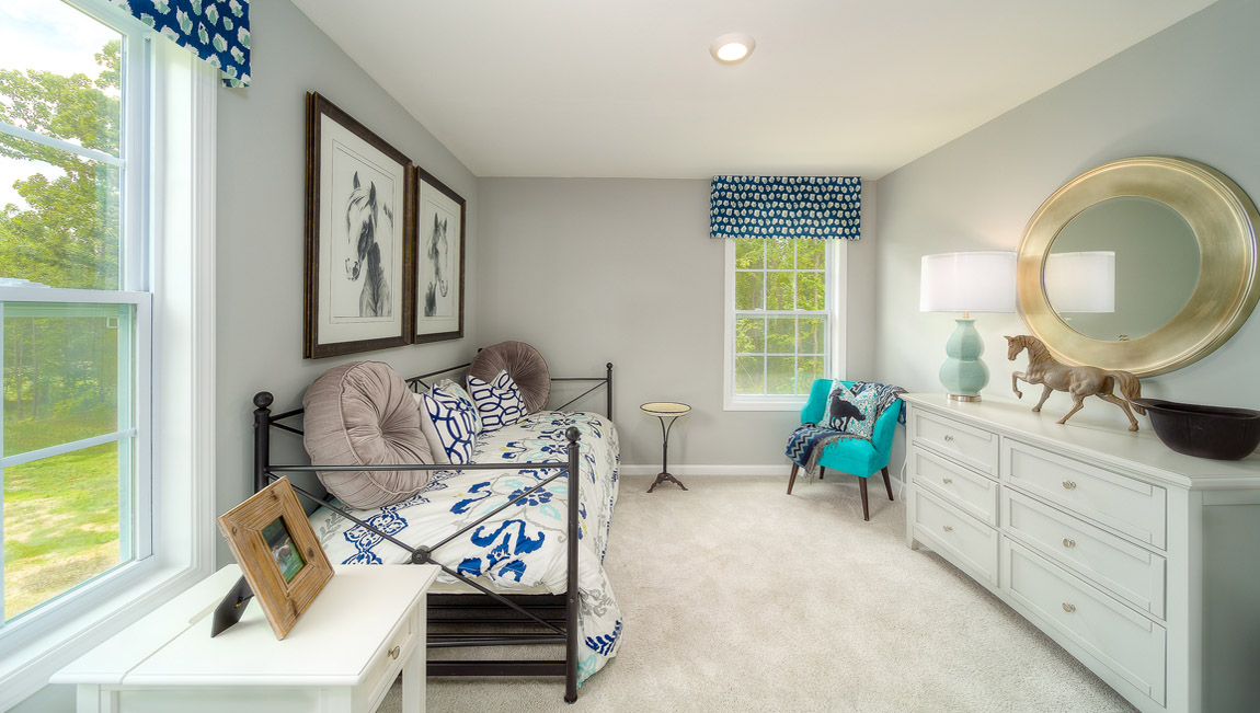 Carpeted bedroom with large window