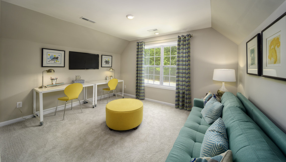 Carpeted bonus room with large window