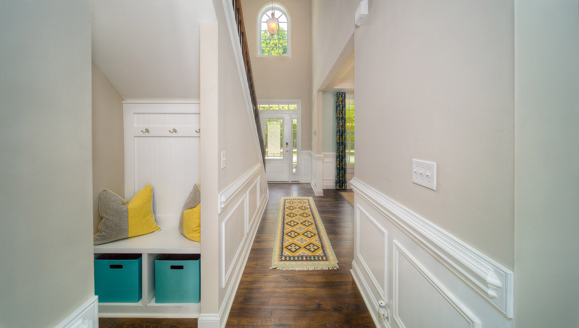 Welcoming foyer, view of drop zone and front door