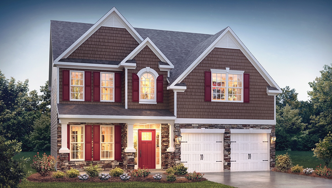 Fleetwood front exterior with brick and siding and two car garage