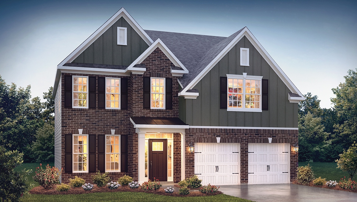 Fleetwood front exterior with brick and siding and two car garage