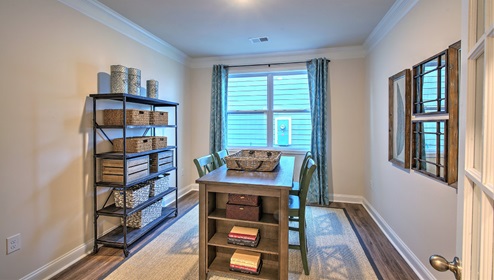 Carpeted office/flex space with small window