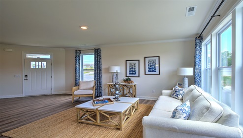Living room with large windows and wood floors