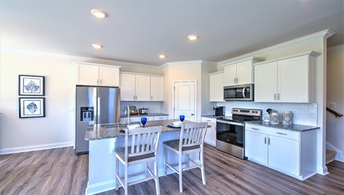 Kitchen and island, with breakfast area, white cabinets