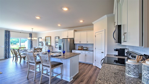 Kitchen and island, with breakfast area, white cabinets