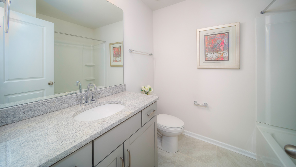 Bathroom with vanity and bathtub
