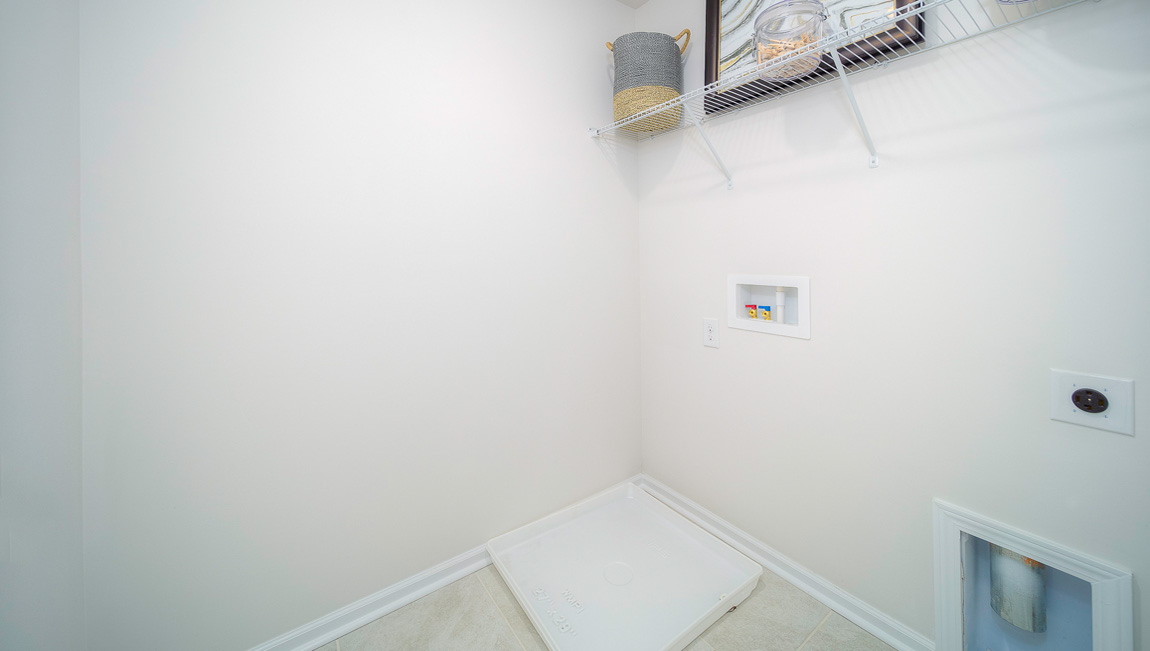 Laundry room with shelving