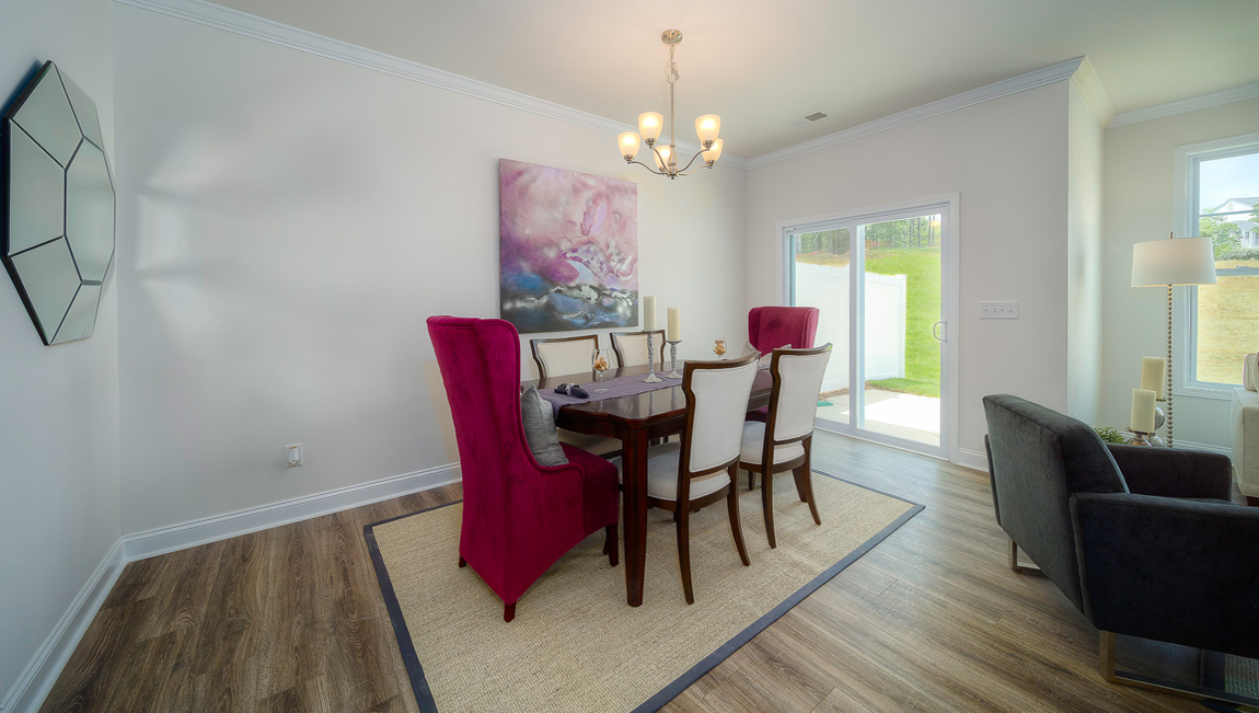 Open concept dining area with sliding glass doors