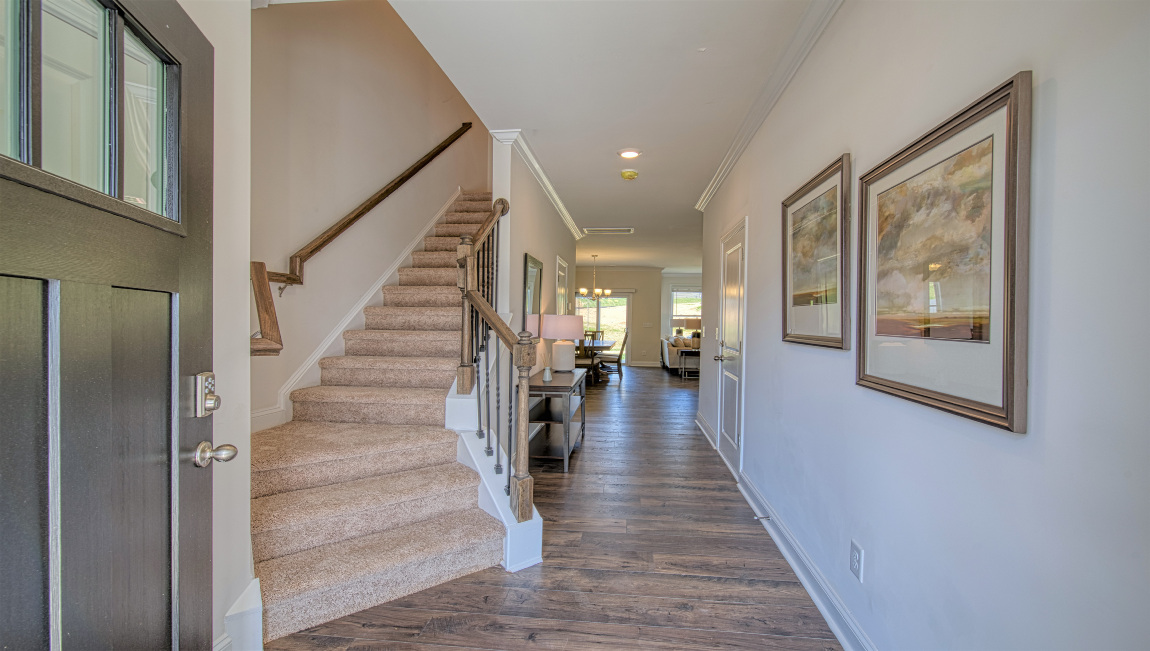Welcoming foyer, view of interior hallway and stairs