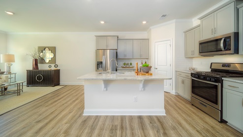 Kitchen and island, wood floor, white cabinets