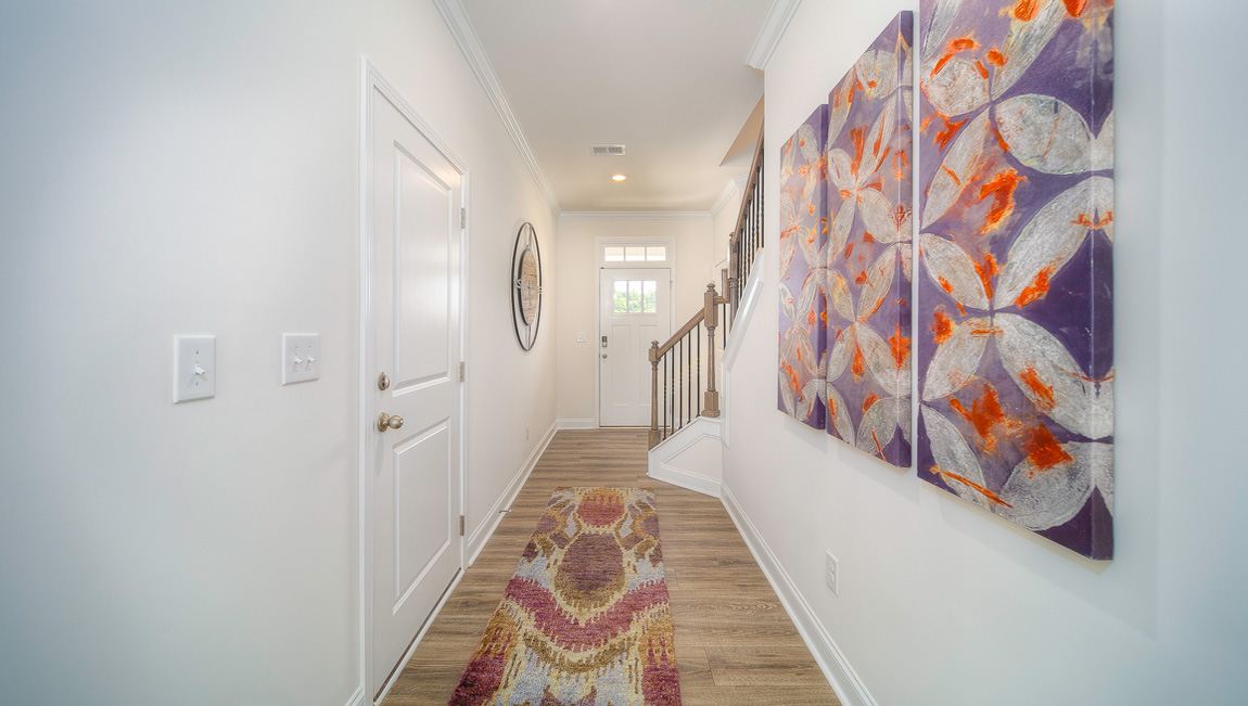 Welcoming foyer, view of hallway and front door
