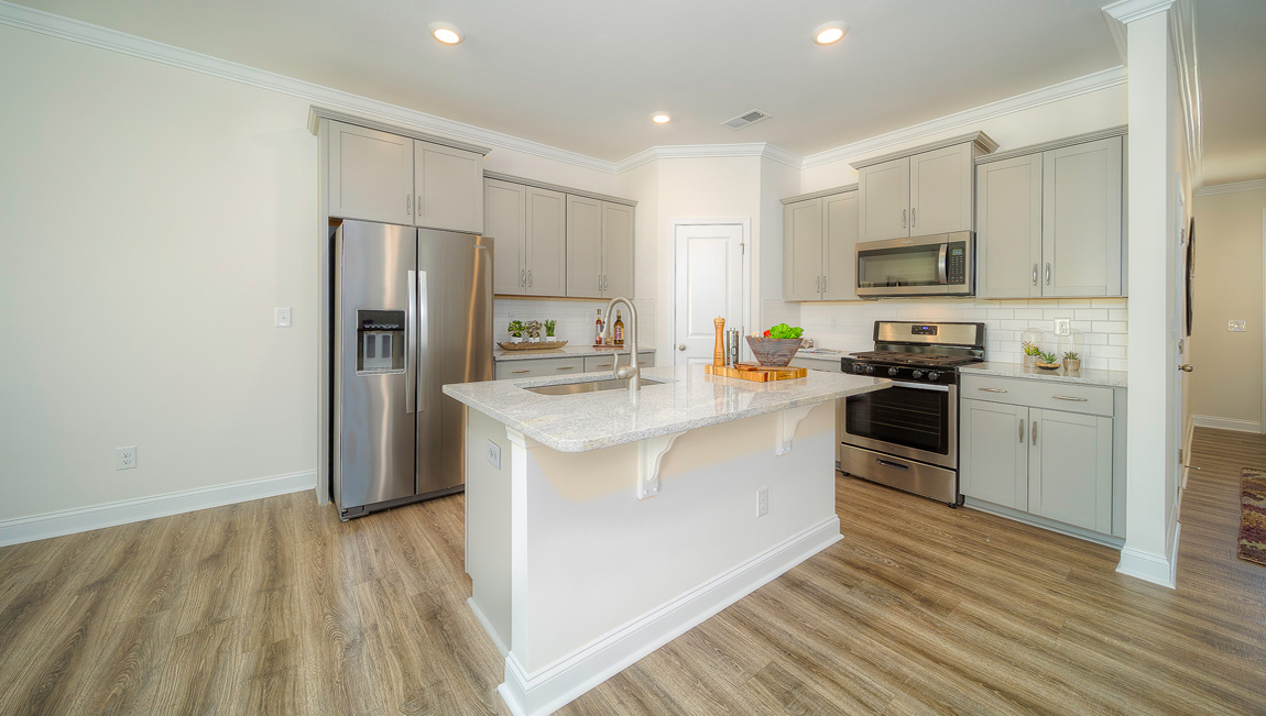 Kitchen and island, wood floor, white cabinets