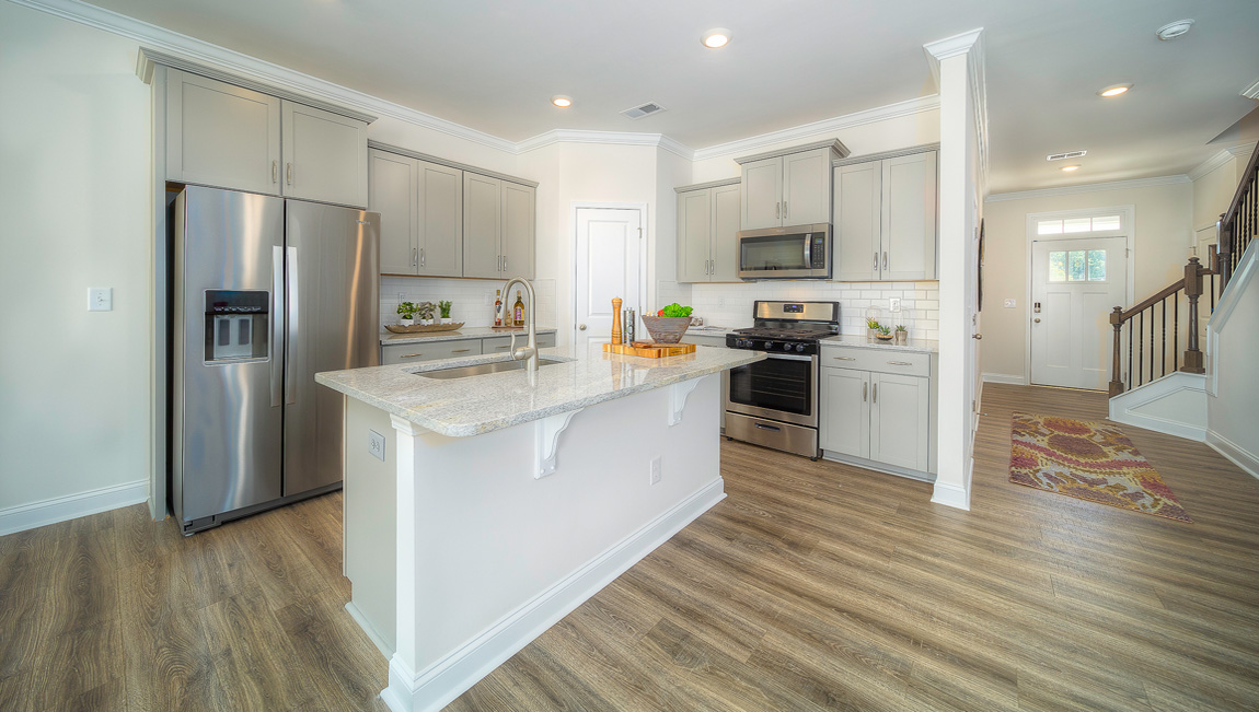 Kitchen and island, wood floor, white cabinets