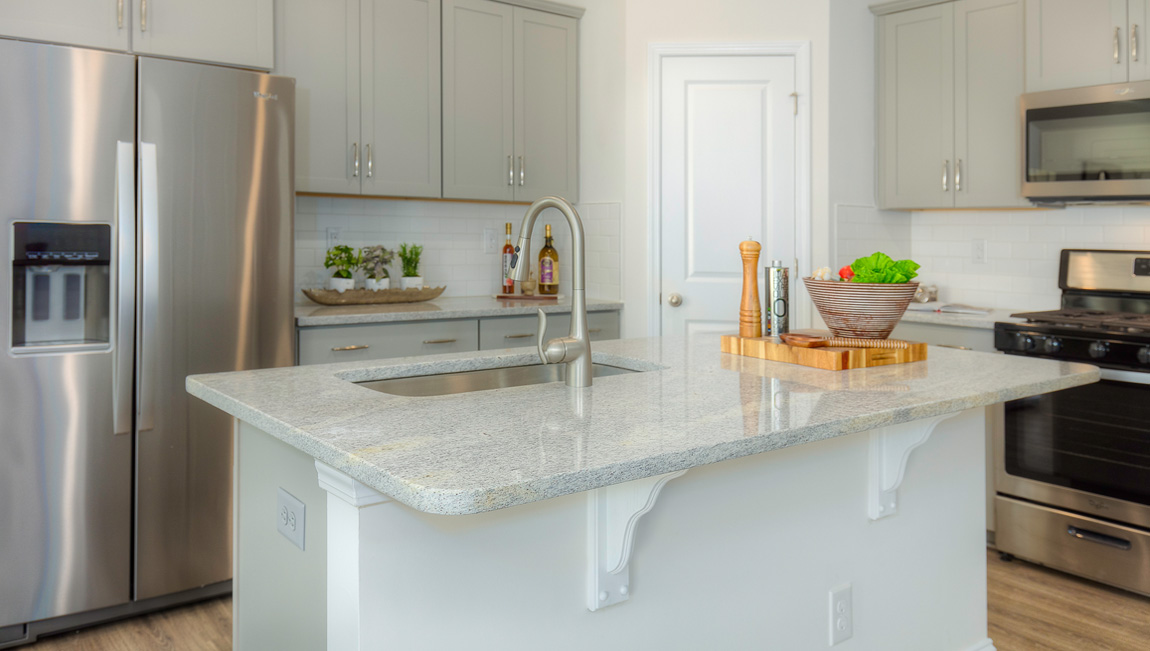 Kitchen and island, wood floor, white cabinets