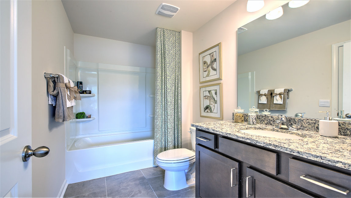 Bathroom with double sinks, and bathtub