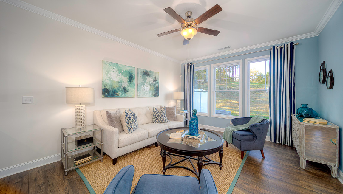 Open concept family room with large windows