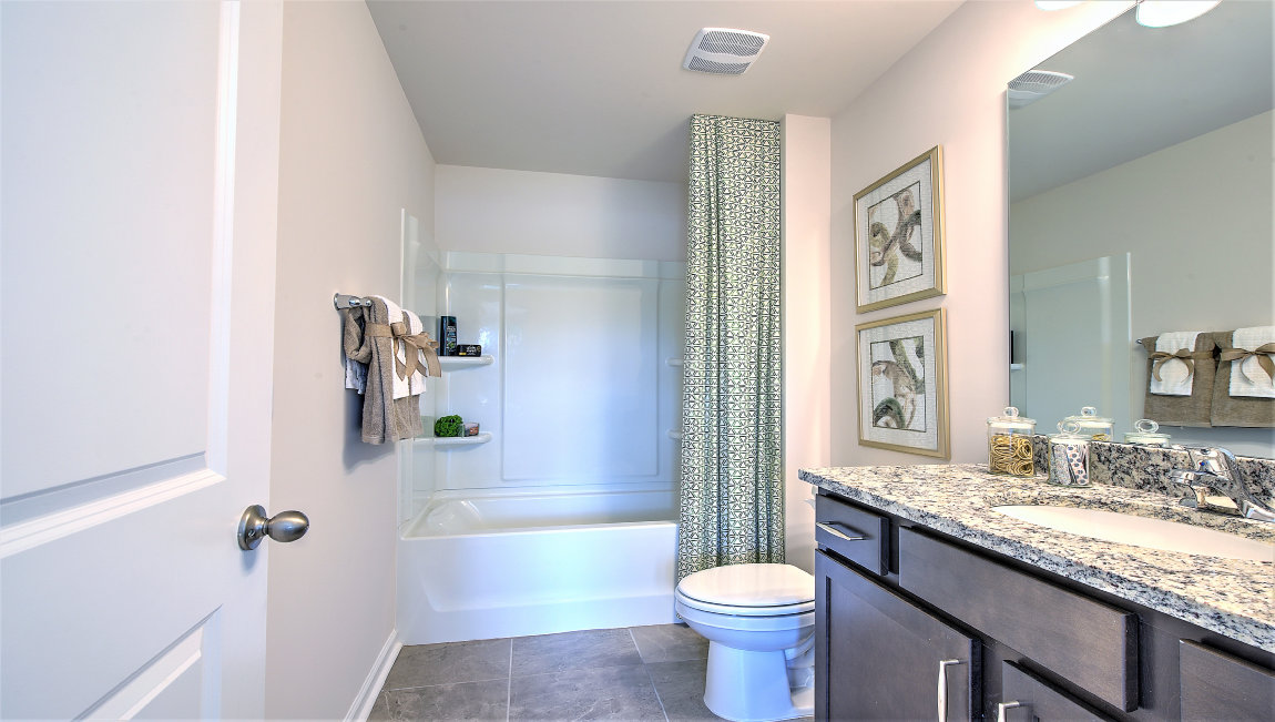 Bathroom with double sinks, and bathtub