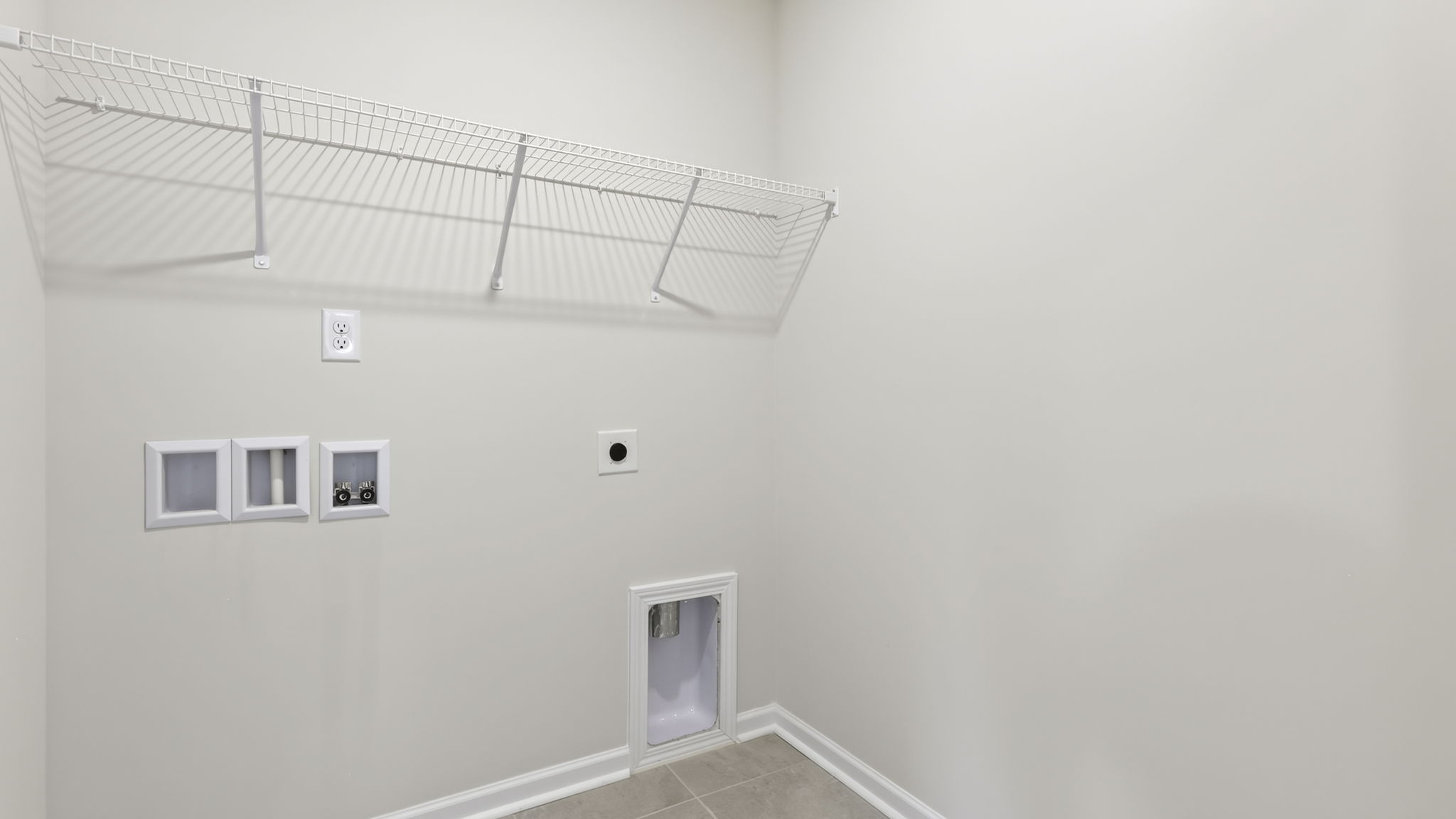 Laundry room with shelving