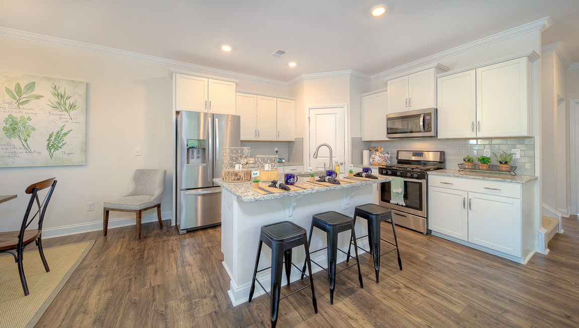 Open kitchen with island and stainless steel appliances