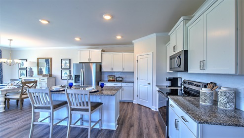 Kitchen and island, with breakfast area, white cabinets