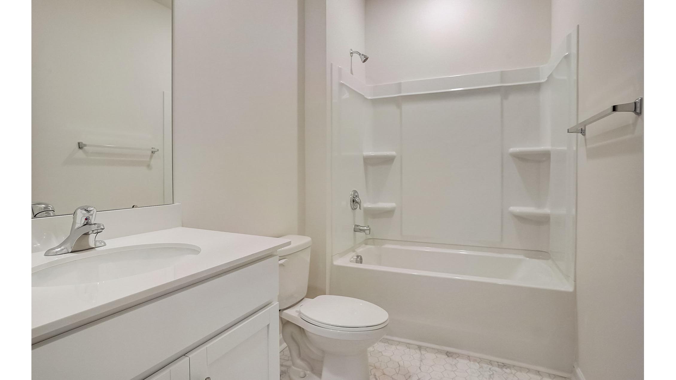 Bathroom with single vanity and bathtub