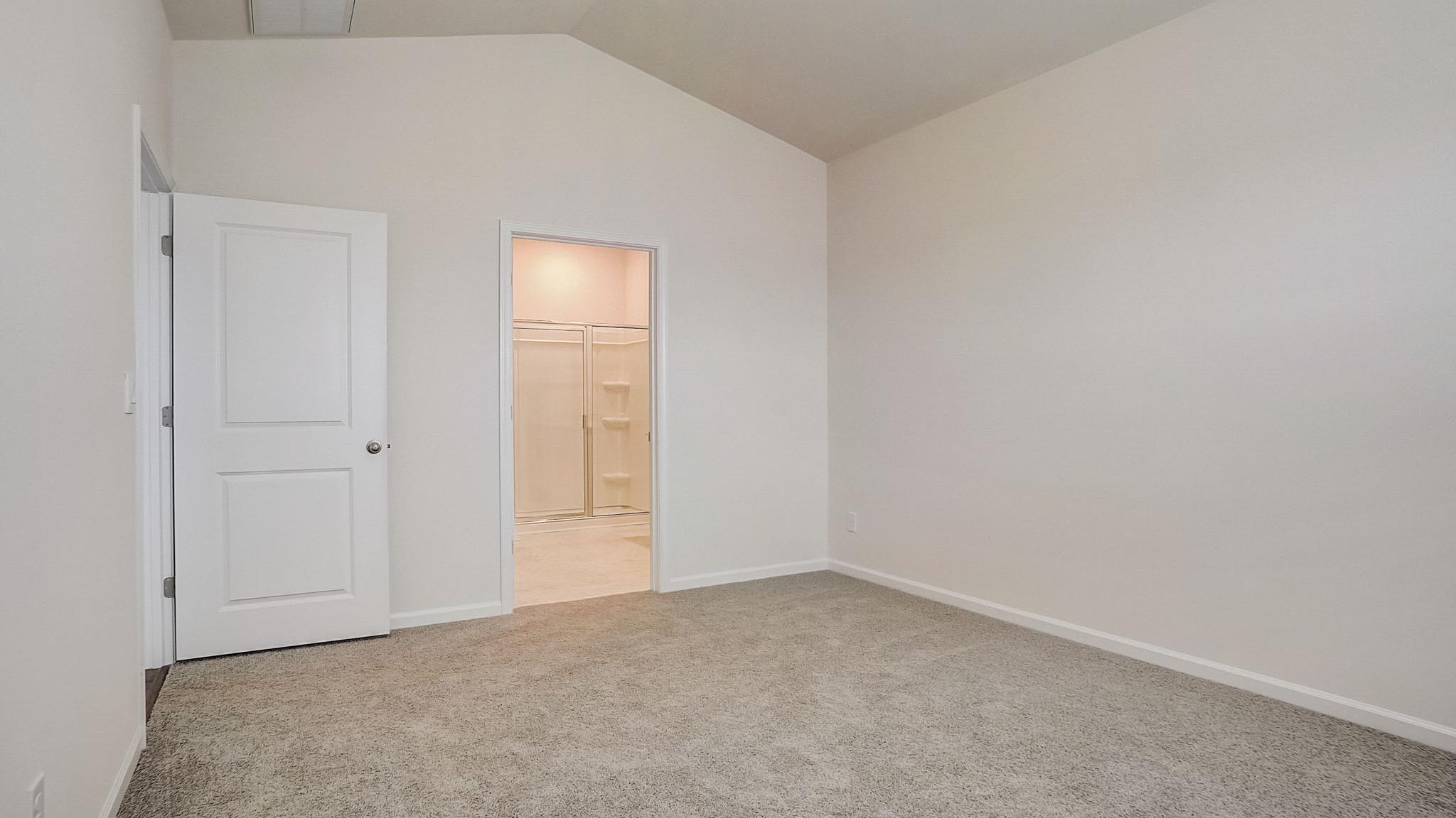 Carpeted bedroom with window