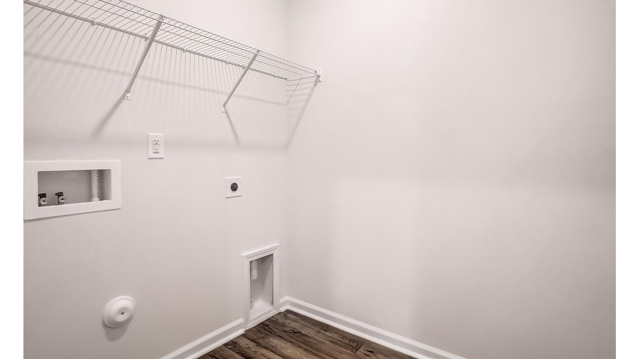 Laundry room with shelving