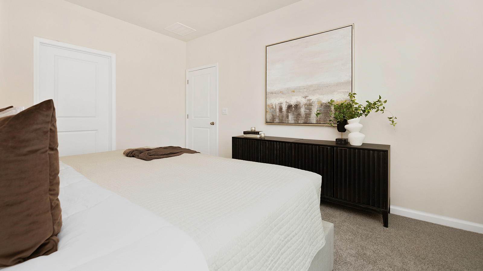 Carpeted bedroom with large window