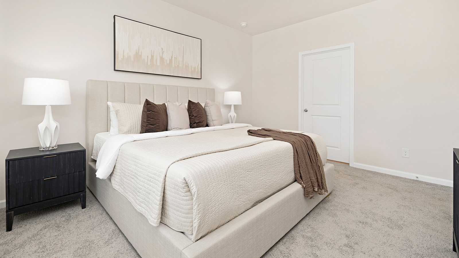 Carpeted bedroom with large window