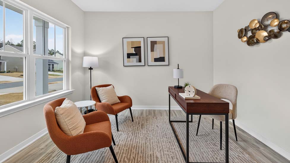 Carpeted bedroom with large window