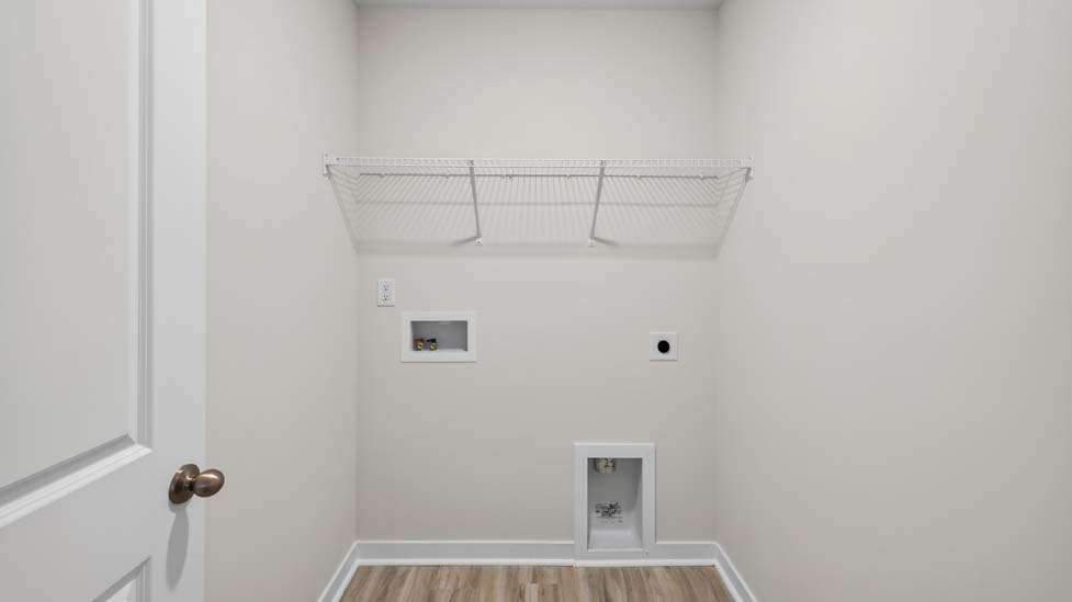 Laundry room with shelving