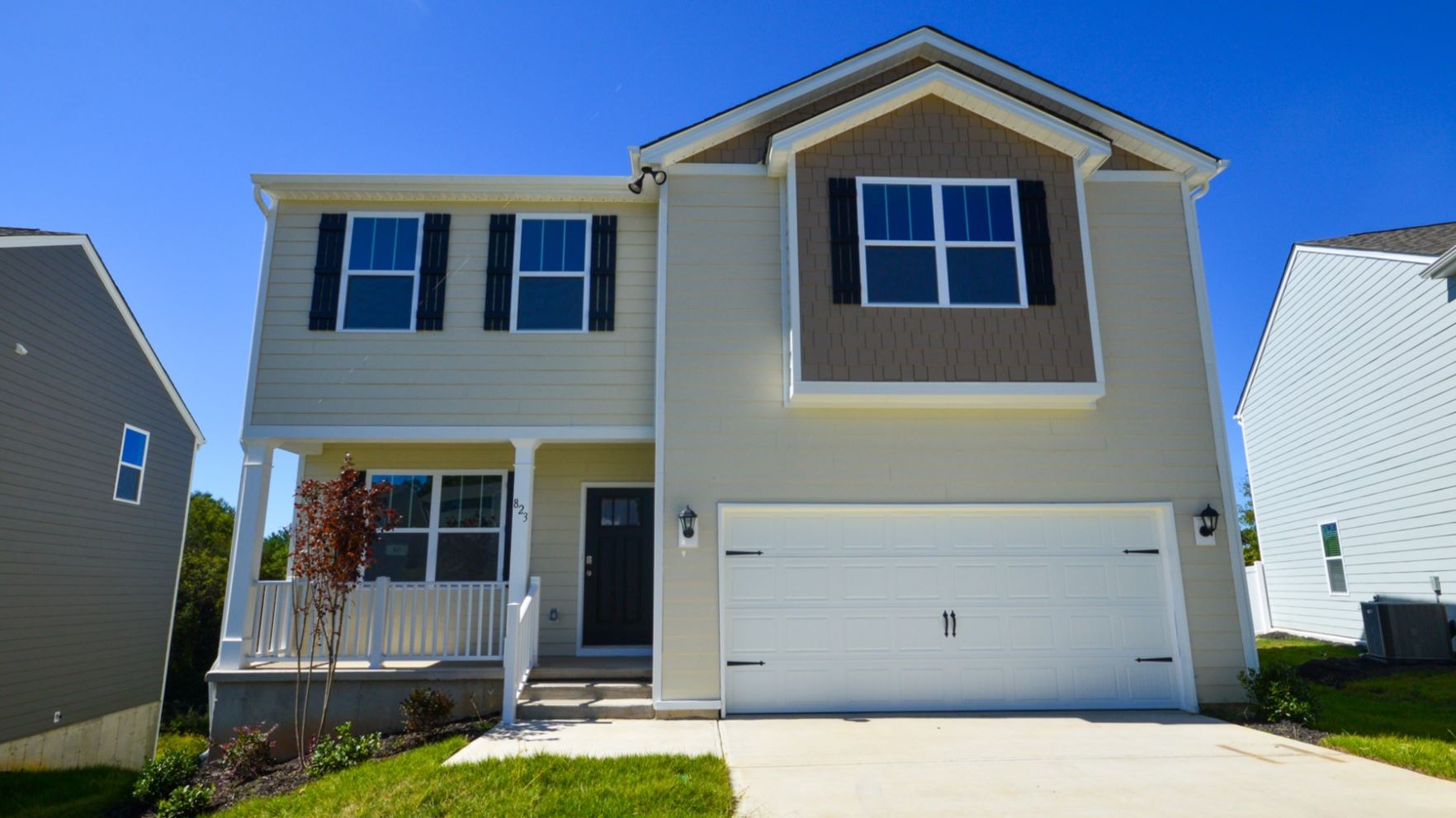 Penwell front exterior with brick and siding and two car garage