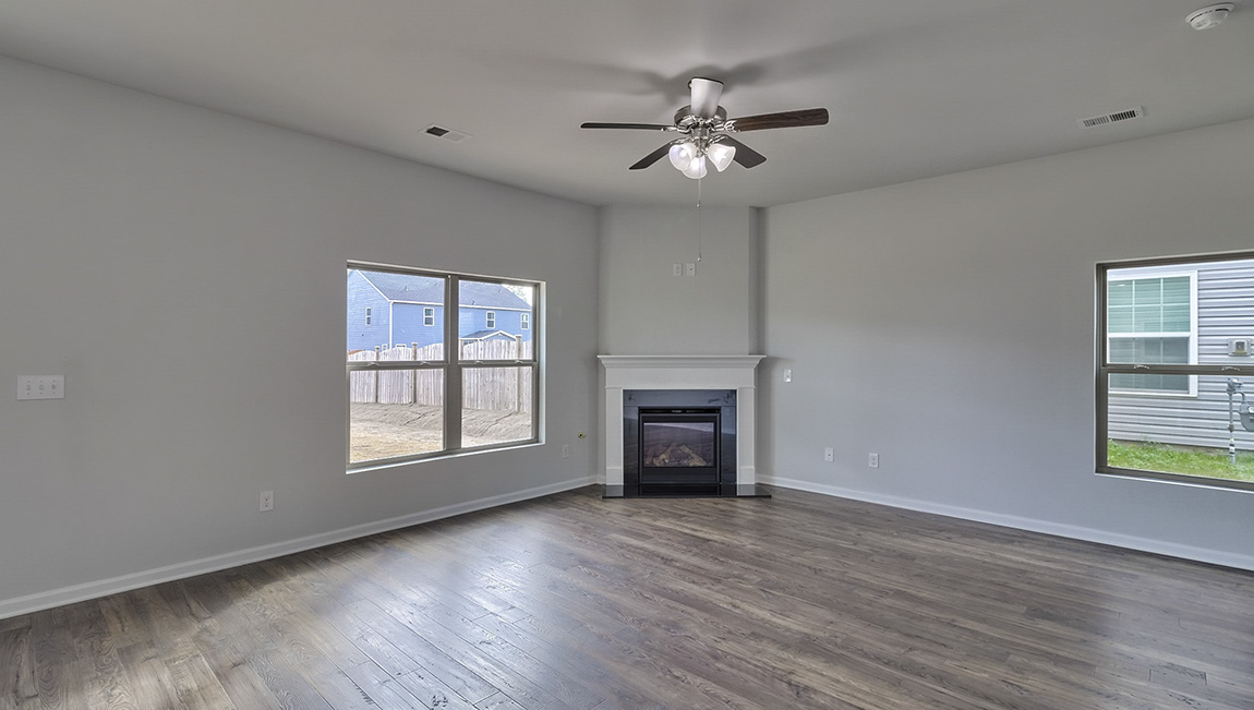 Living room with large windows and fireplace