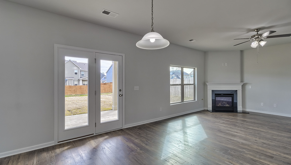 Breakfast area with glass back door and view of living room