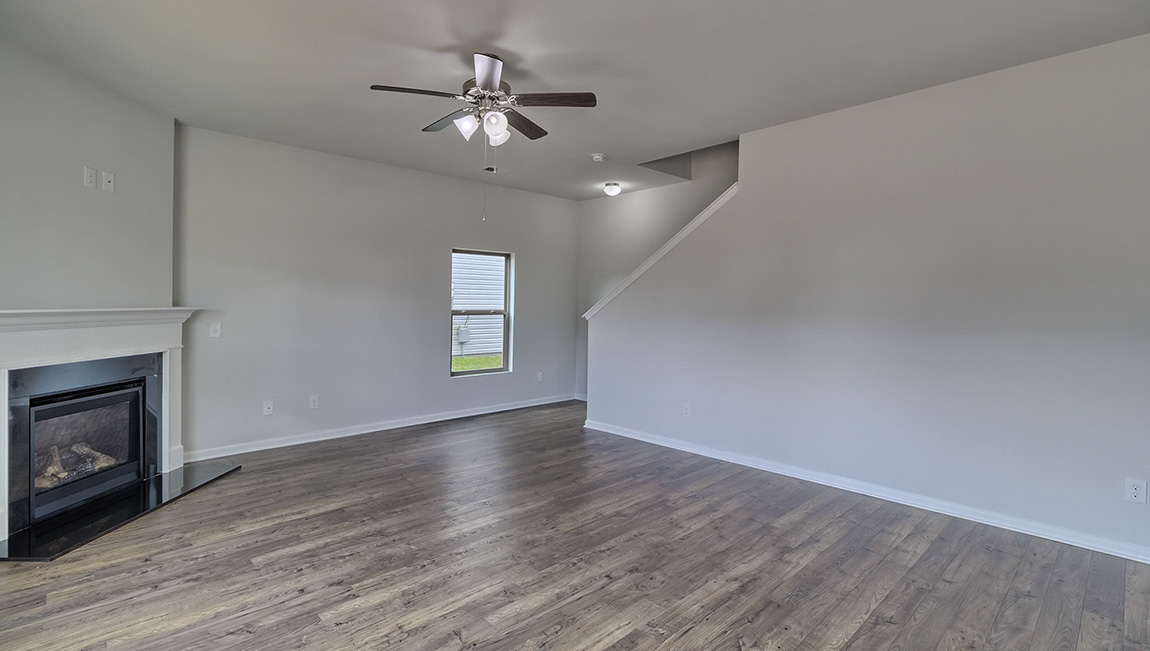 Living room with large windows and fireplace